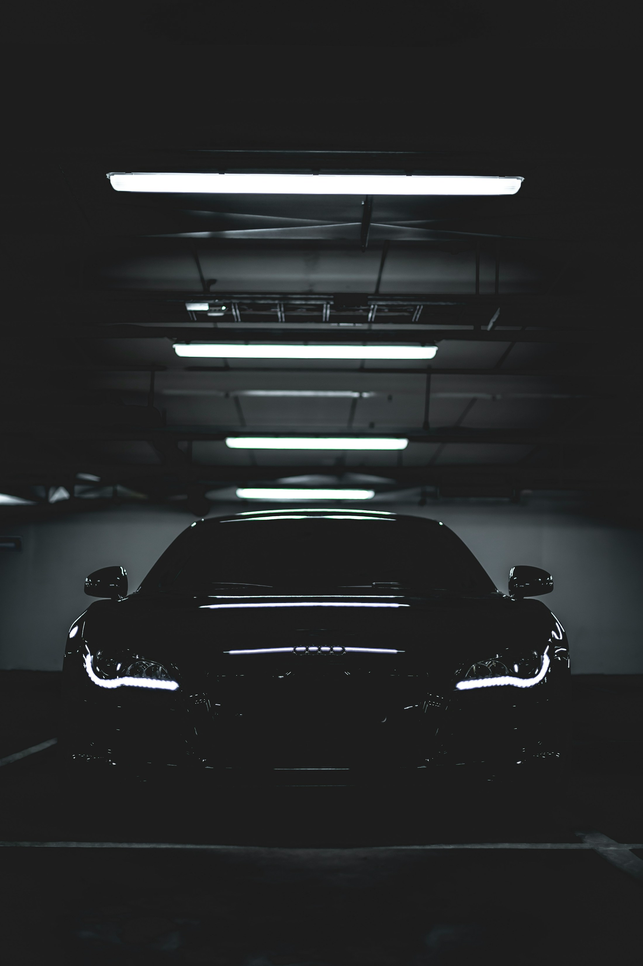 Black car in a dark garage