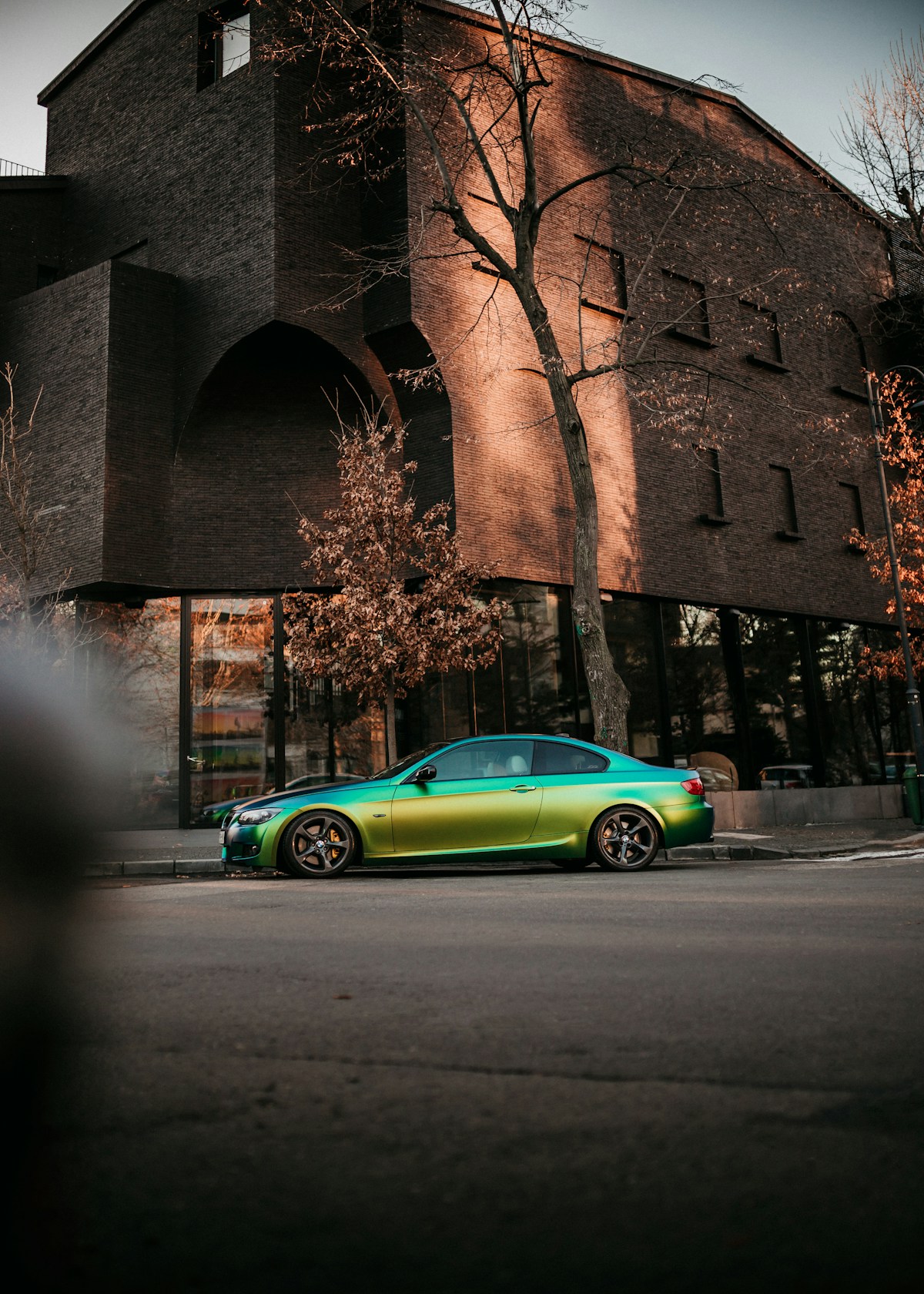 Custom green wrapped car on the street
