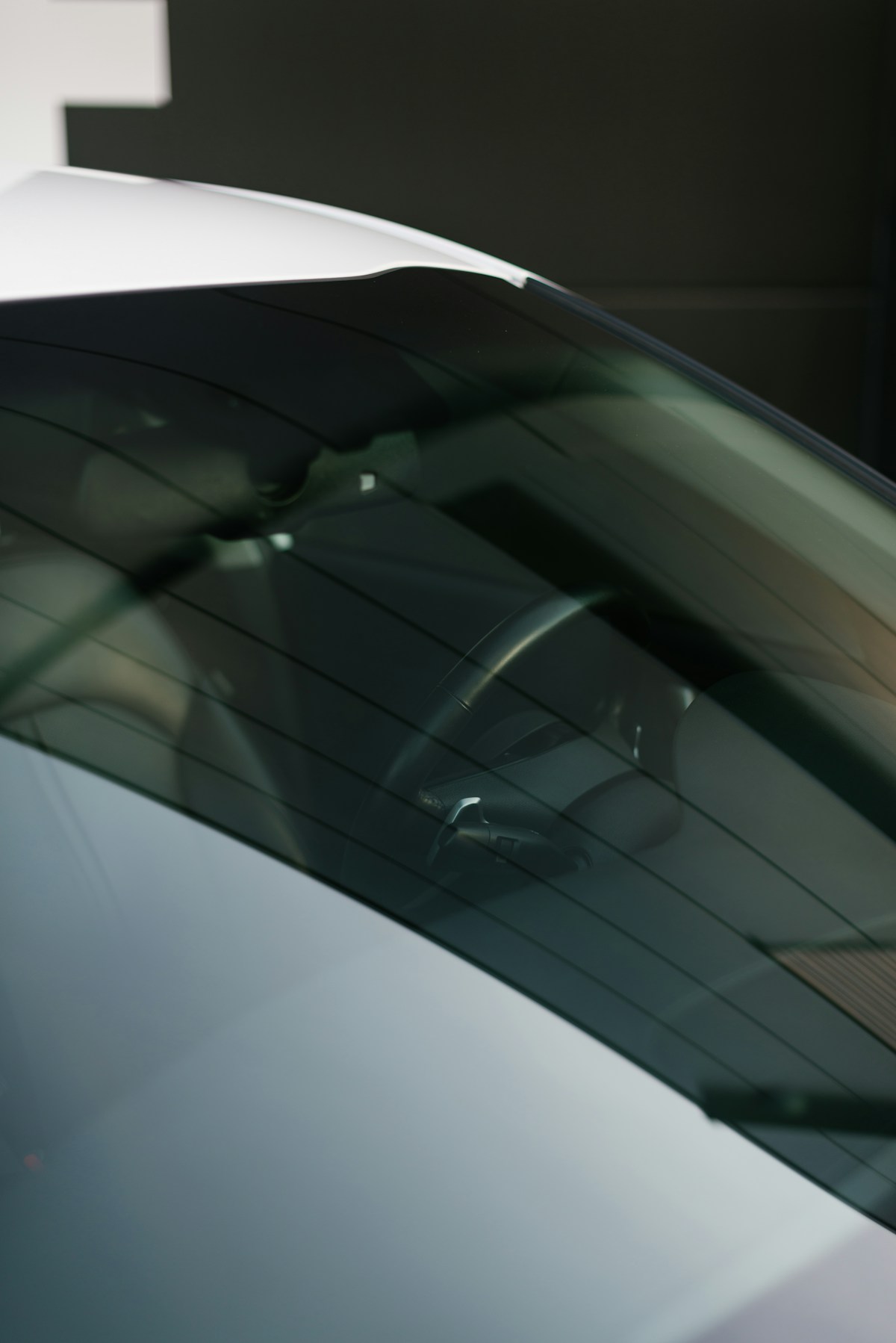 Clean tinted glass on a white car